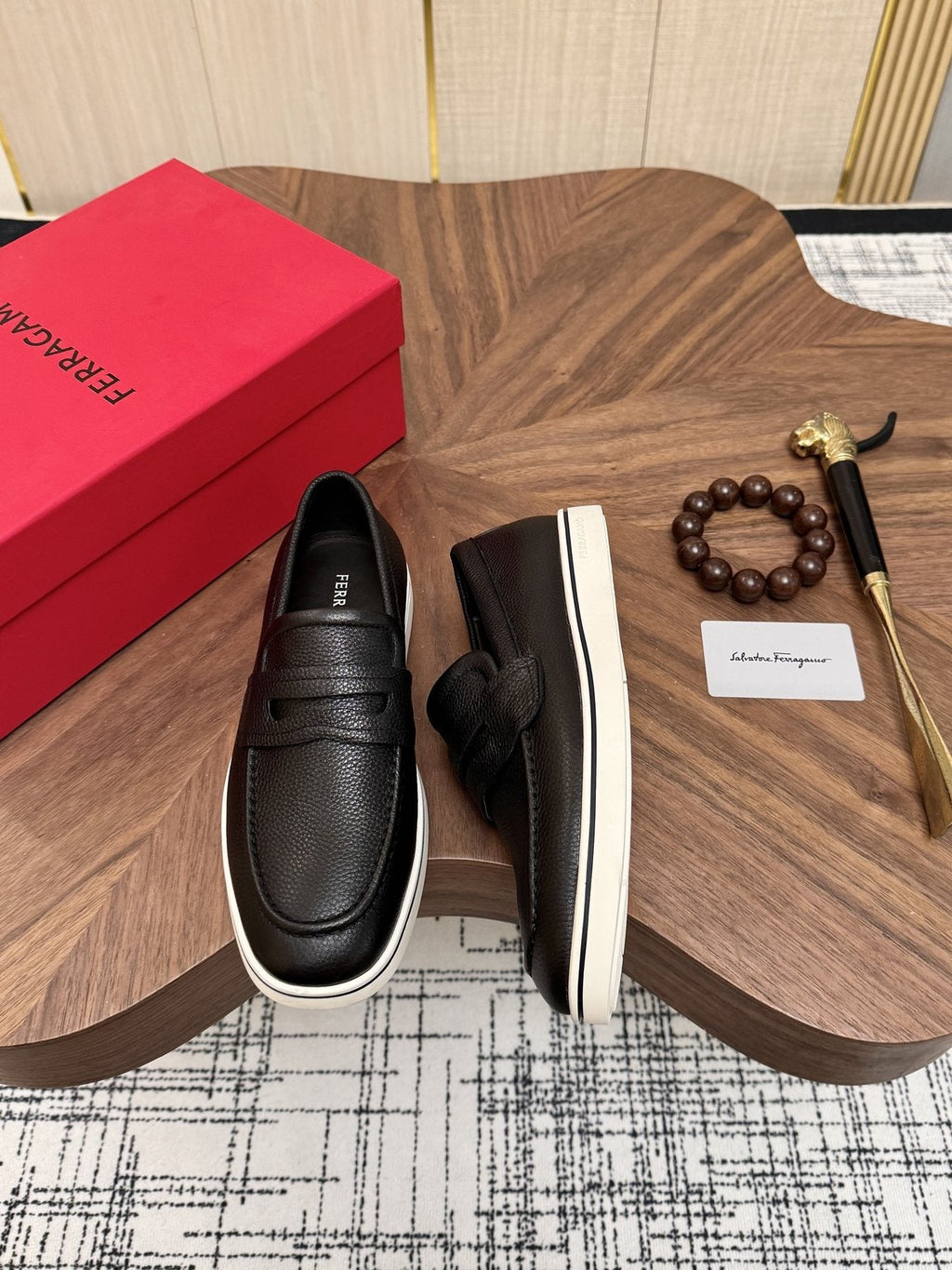 Salvatore Ferragamo Black Loafers with White Soles — front
