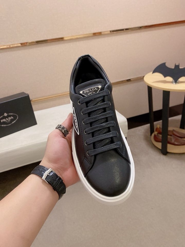 Prada Plaque Low-Top Sneakers — model